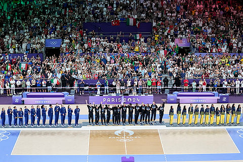 Gold medalist Italy, center, silver medalist United States and bronze medalist Brazil, right, stand on the podium during the victory ceremony